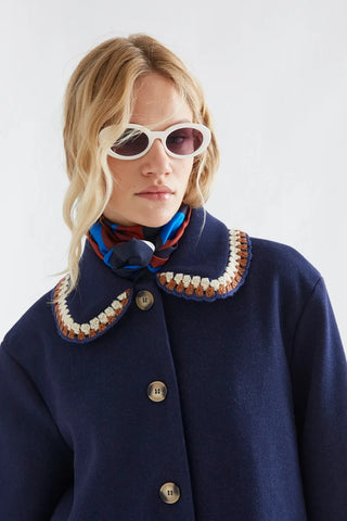 Navy blue coat with crochet details